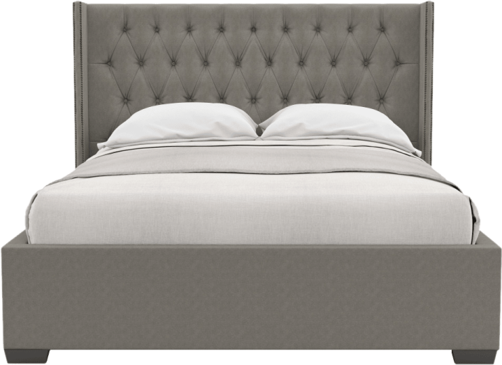 a bed with a grey headboard and white pillows