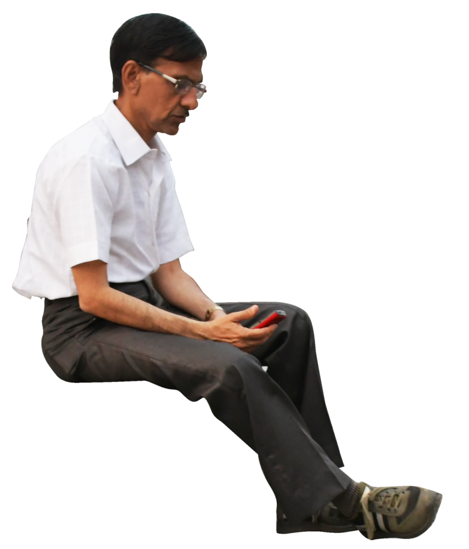 a man in white shirt and black pants sitting on the ground
