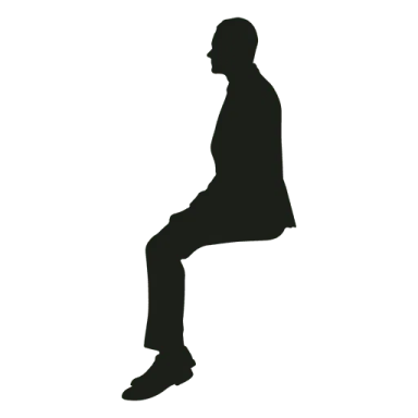 a silhouette of a man sitting on the ground