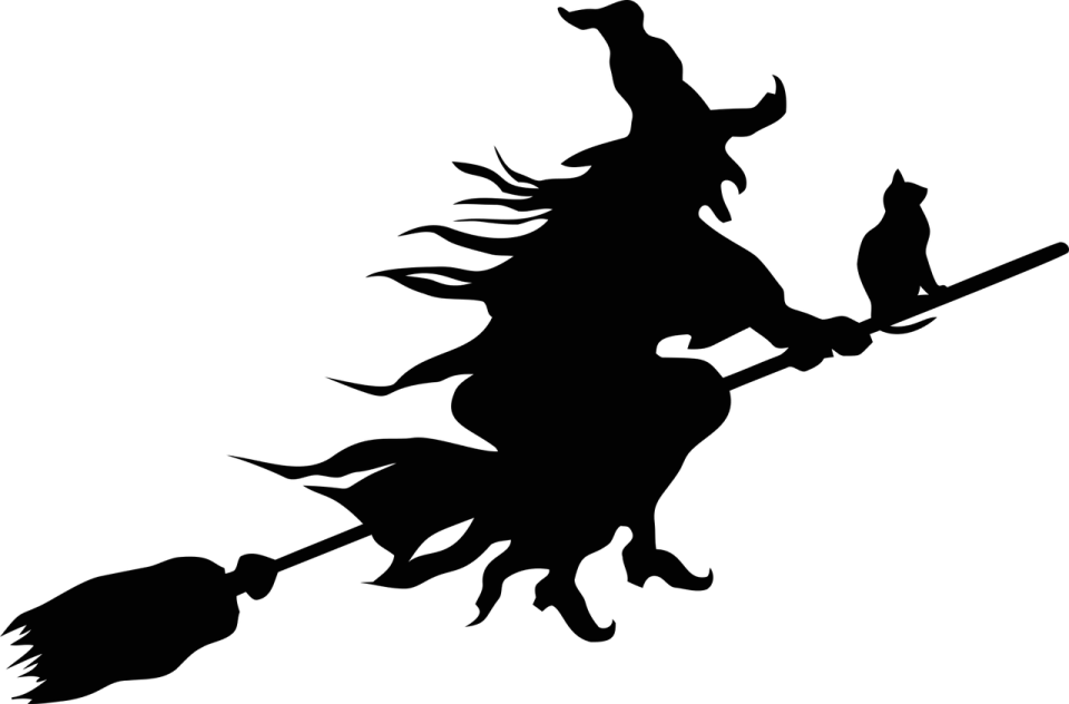 a silhouette of a witch flying on a broom