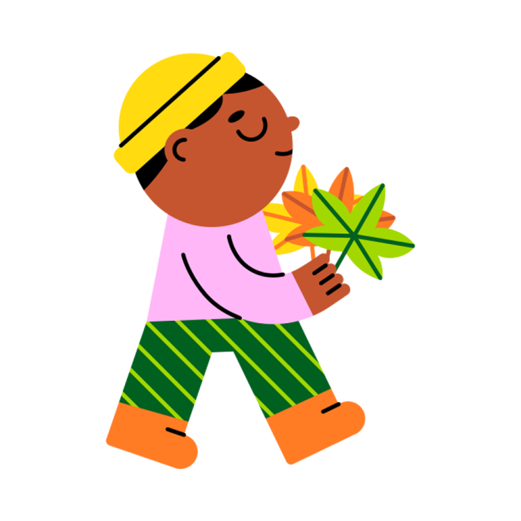 a boy holding a leaf in his hand