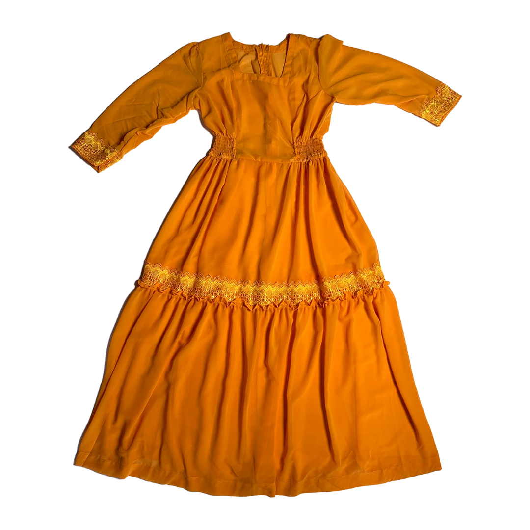 an orange dress with yellow embroidery on the shoulders