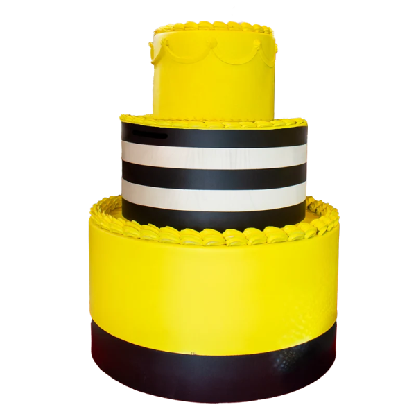 a yellow cake with black and white stripes