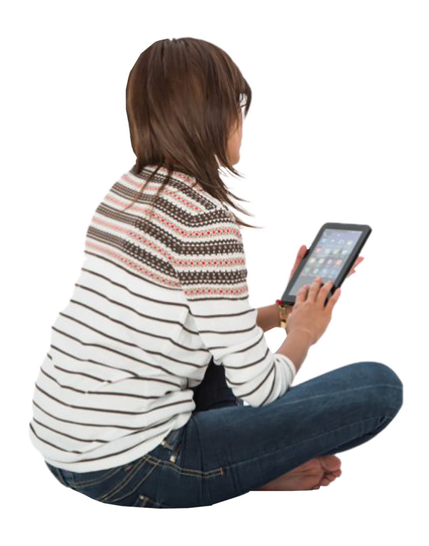 a woman sitting on the floor using her tablet