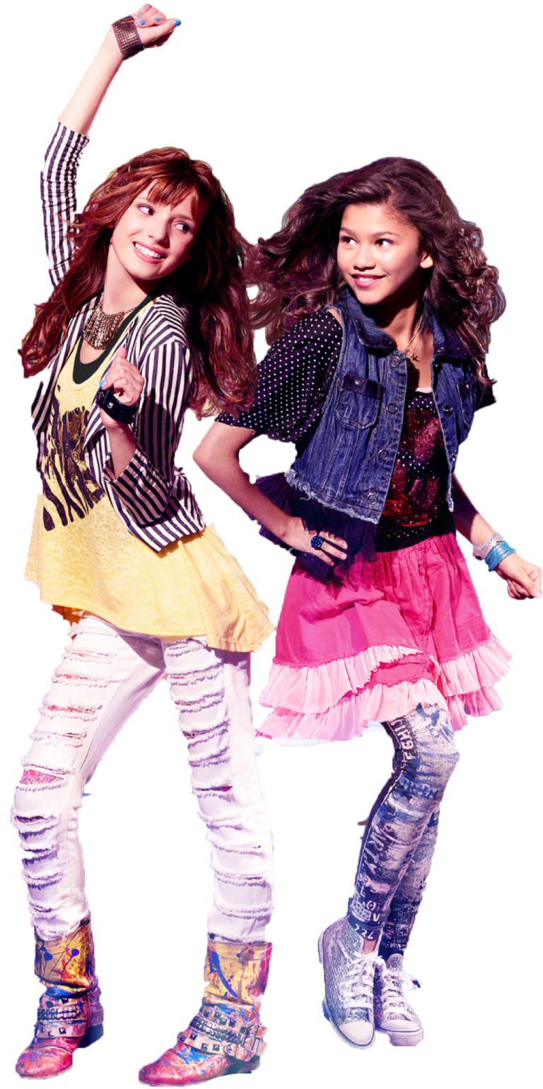 two young girls are dancing together