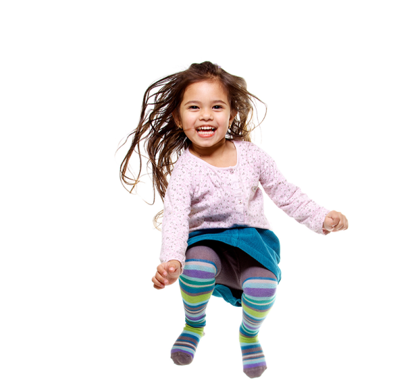 a little girl is jumping in the air