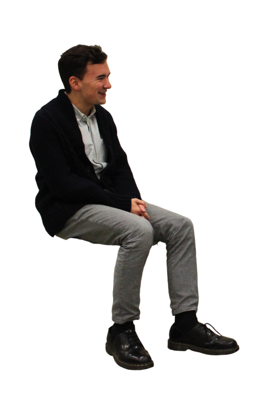 a man sitting on top of a wooden bench