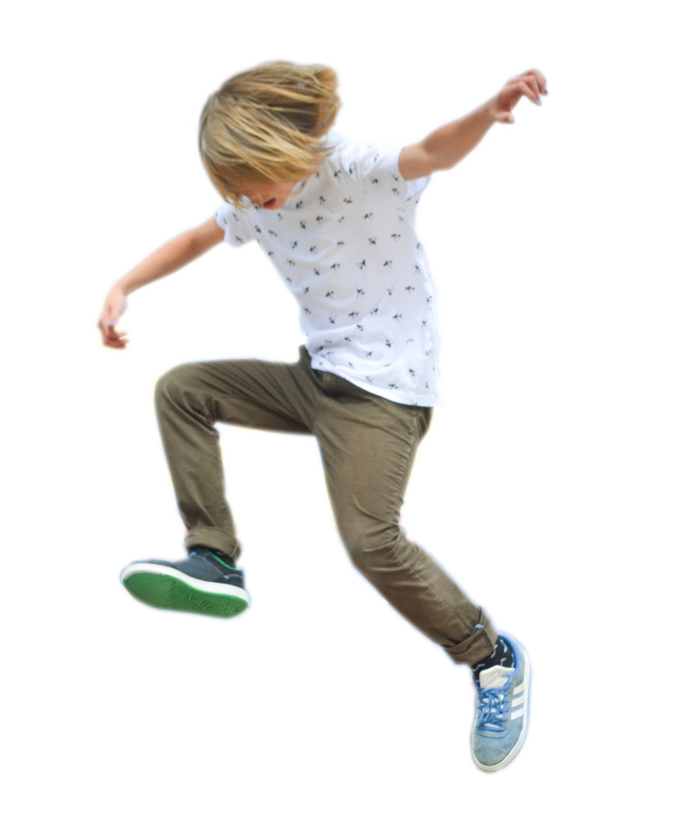 a young boy is jumping in the air