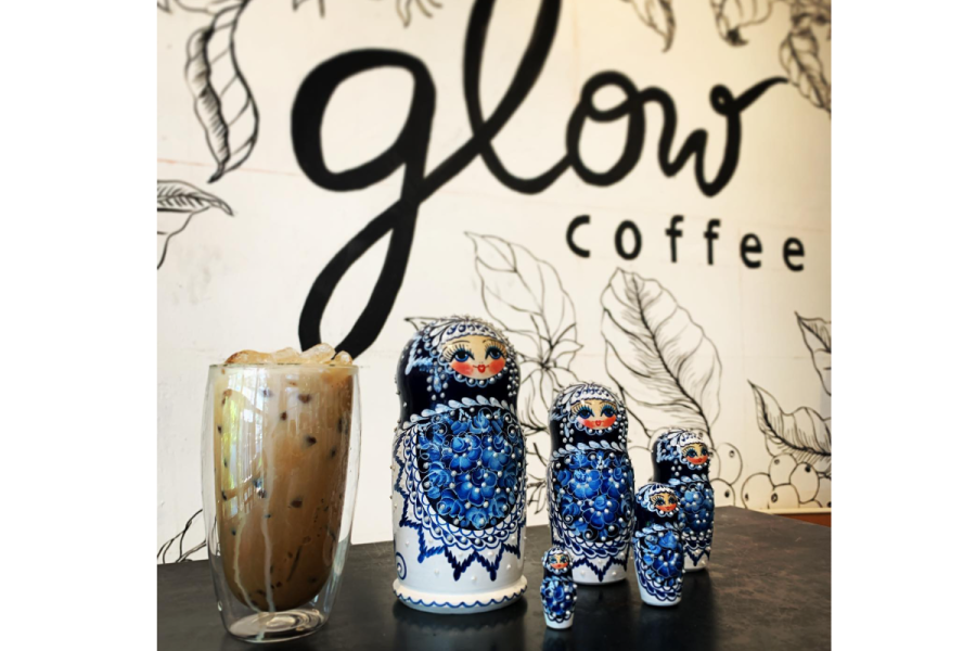 two cups of coffee and a glass with a drink in it