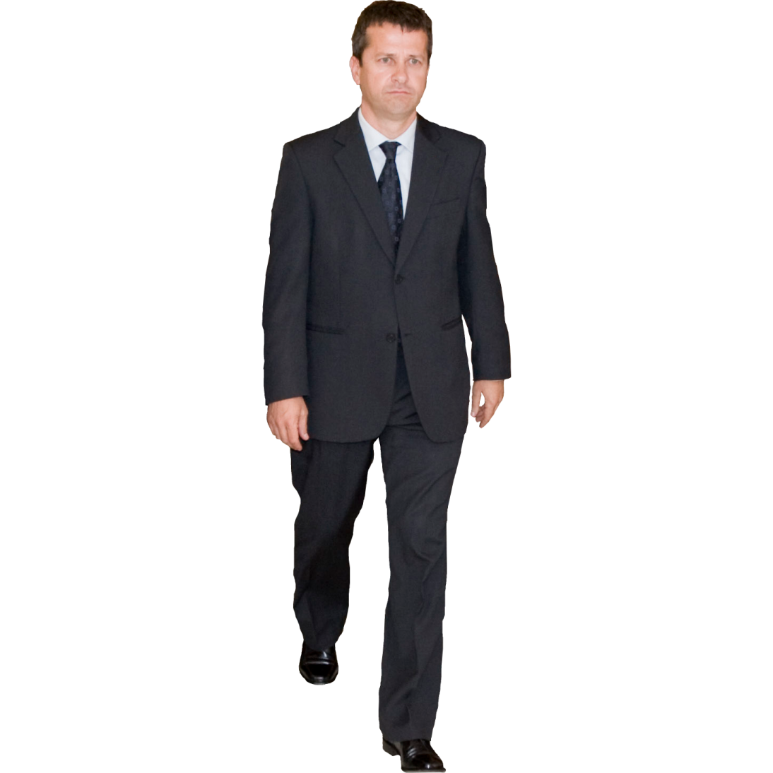 a man in a suit and tie walking