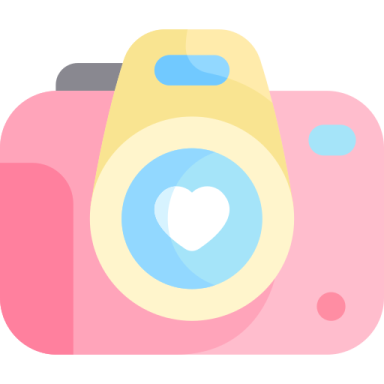 a pink camera with a heart on it