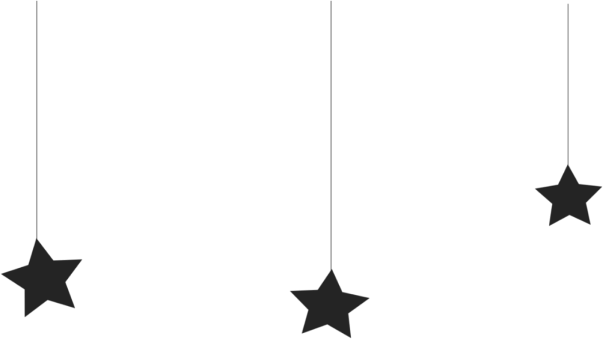 a black and white image of stars hanging from the ceiling