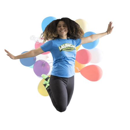 a woman jumping in the air with balloons