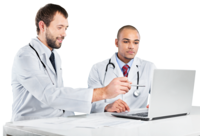 two doctors looking at a laptop computer