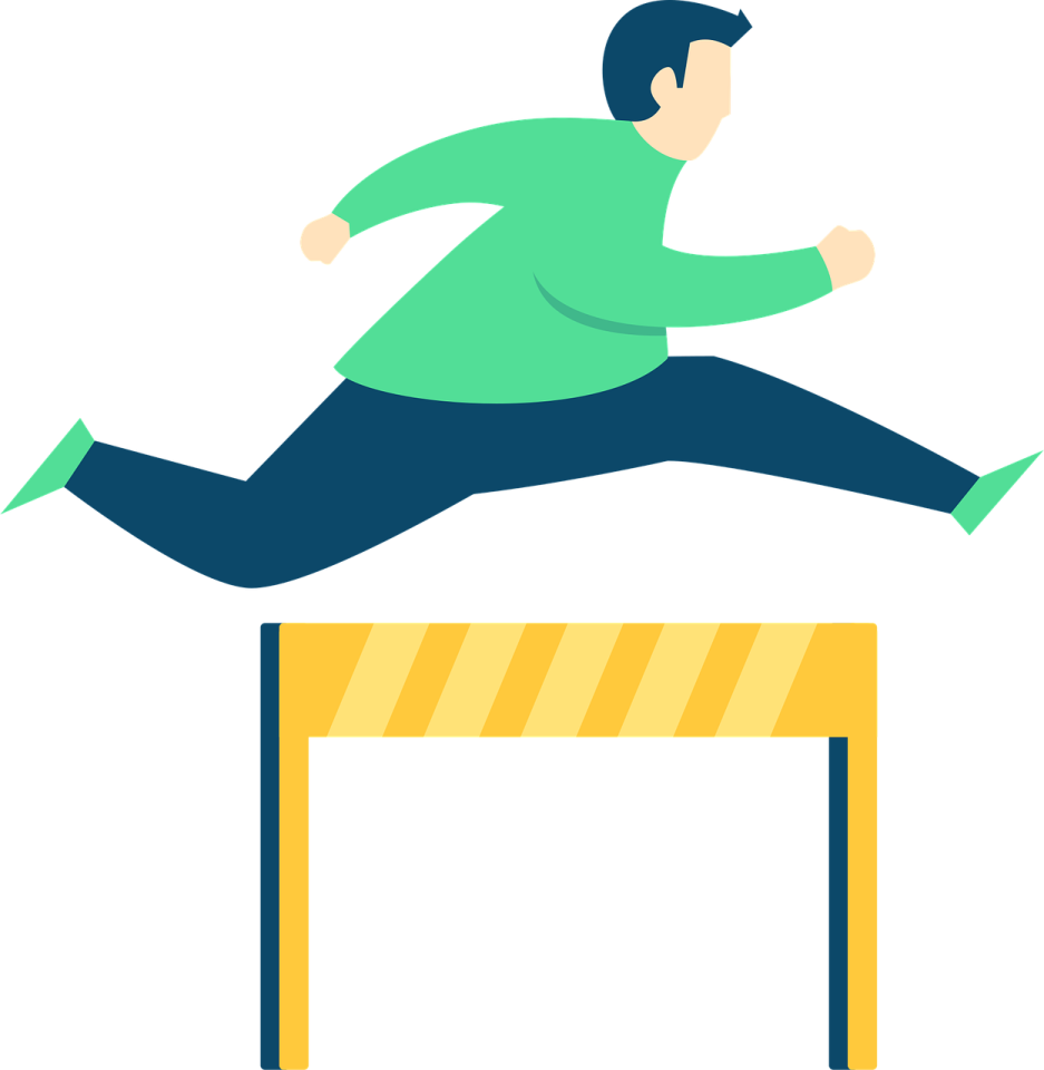 a man jumping over a hurdle