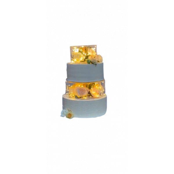 a three tiered cake with flowers on top