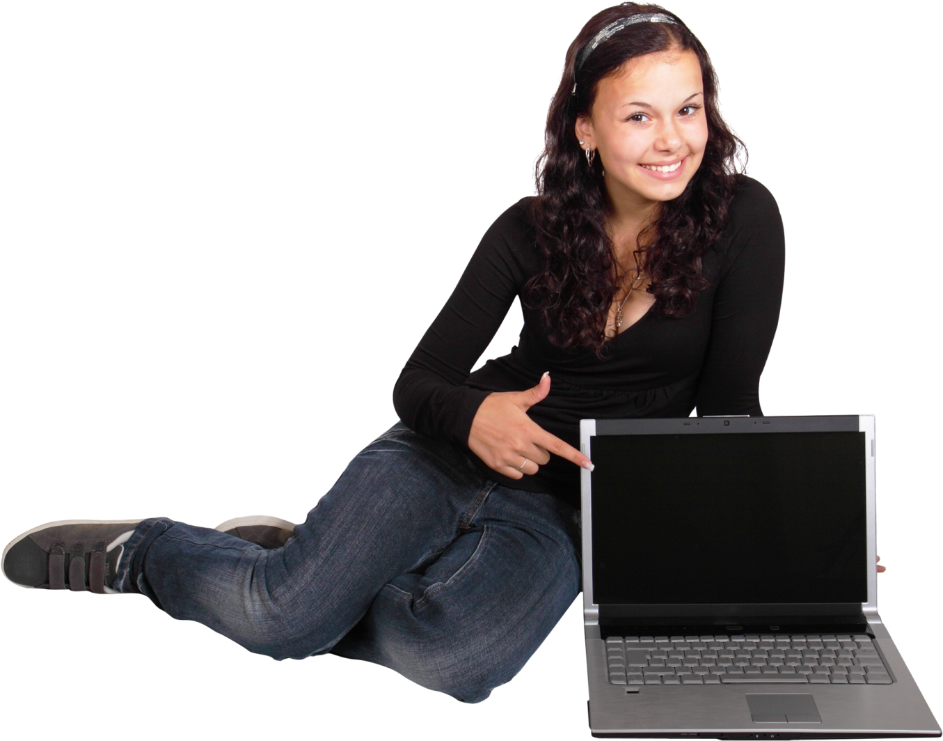a woman sitting on the floor with her laptop