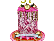 a birthday cake with pink and gold decorations