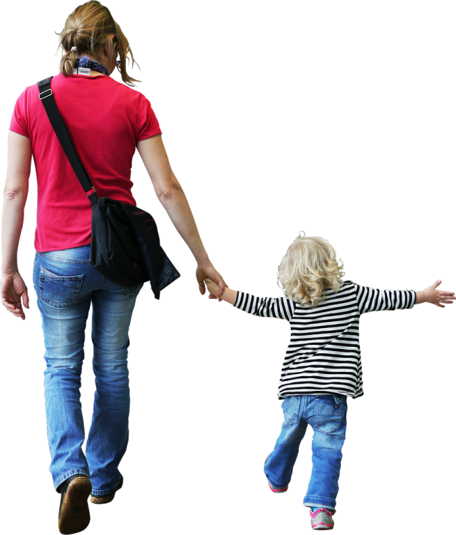 a woman holding the hand of a child