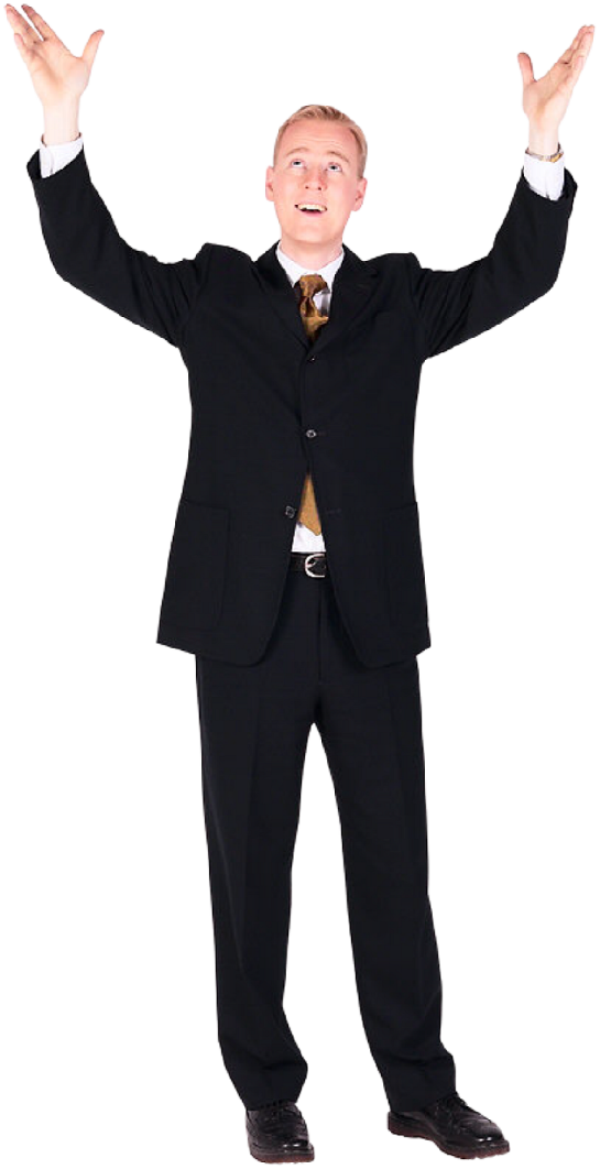 a man in a suit and tie with his hands up