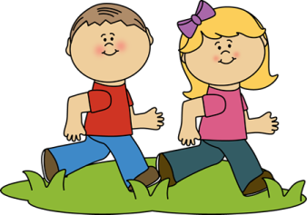 a boy and girl walking in the grass