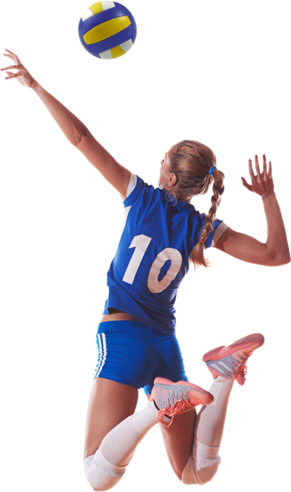 a woman jumping in the air to hit a volleyball ball