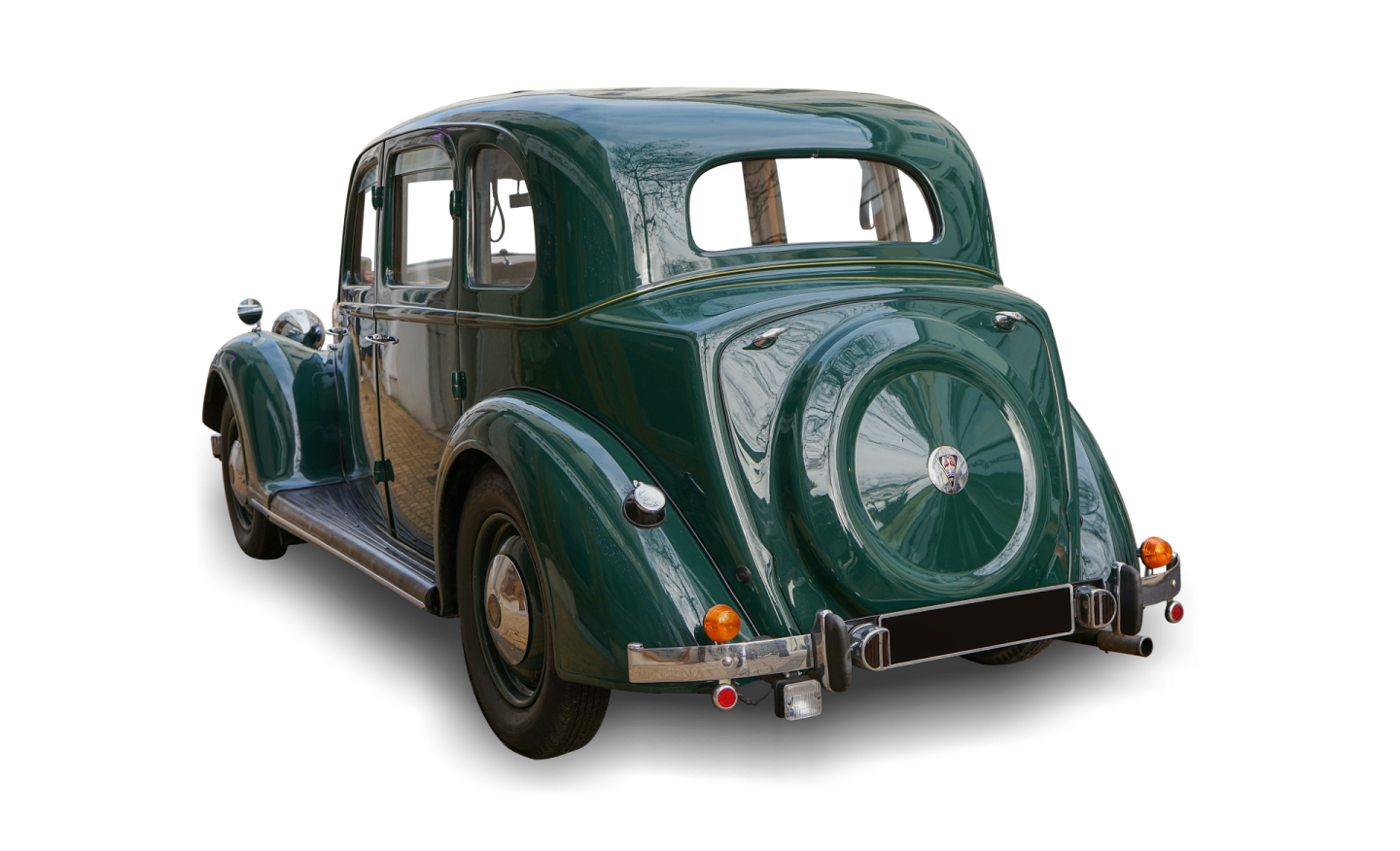 an old green car on a white background