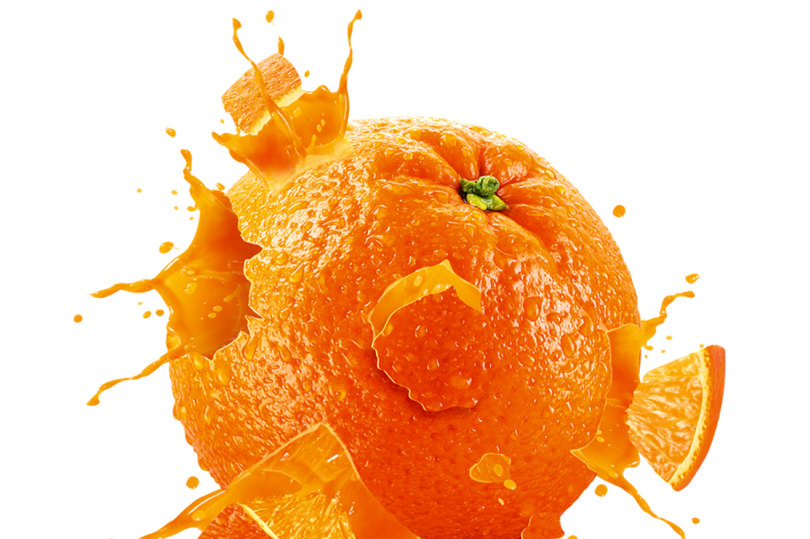 an orange splashing into the ground