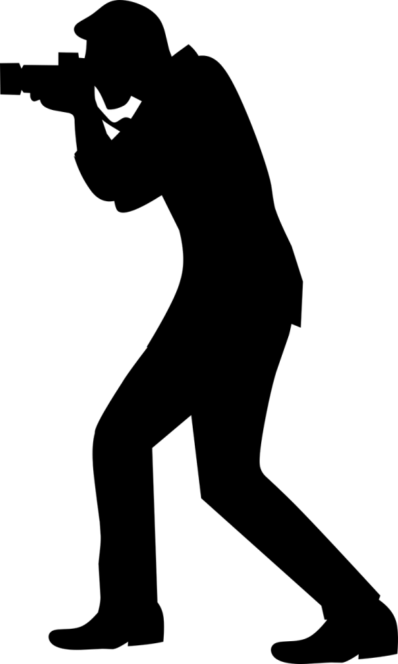 a silhouette of a man shooting with a rifle