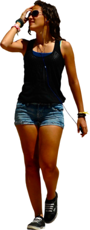 a woman walking while talking on a cell phone