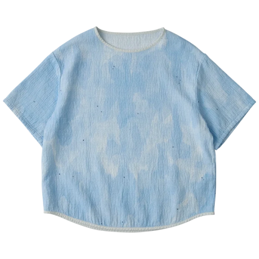 a blue t - shirt with white spots on it