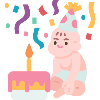 a baby sitting next to a birthday cake