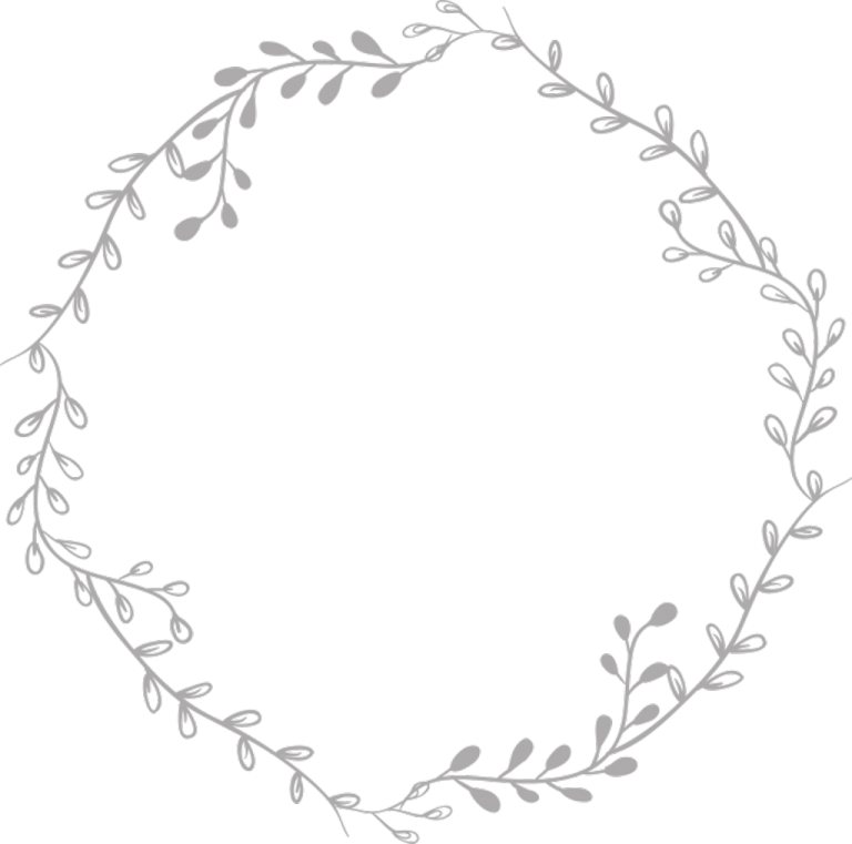 a circular frame with leaves in the middle