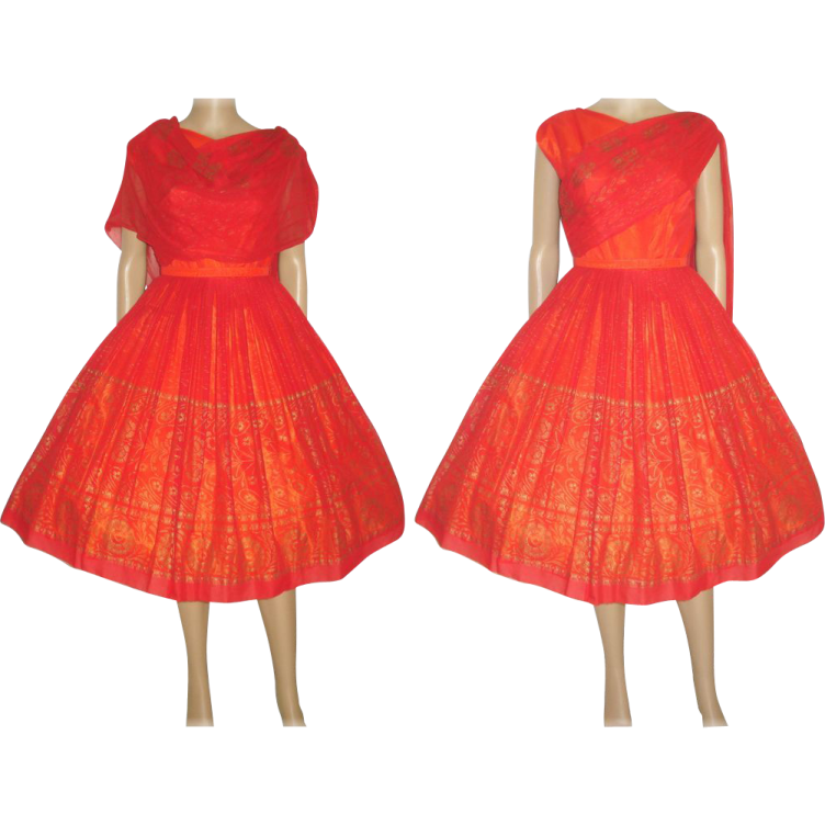 a red dress with gold embroidery on the shoulders