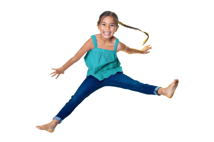 a little girl jumping in the air
