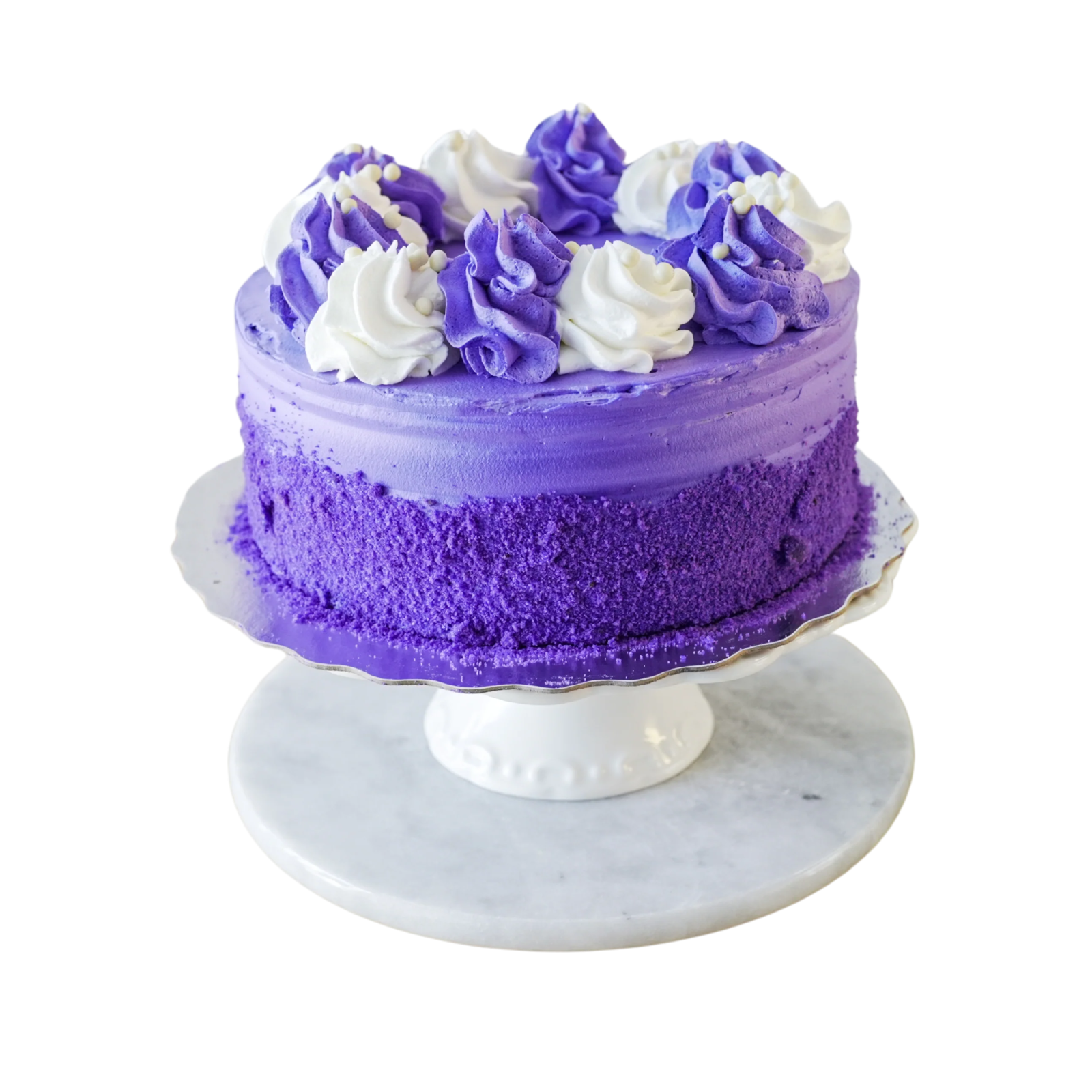 a purple cake with white frosting on top