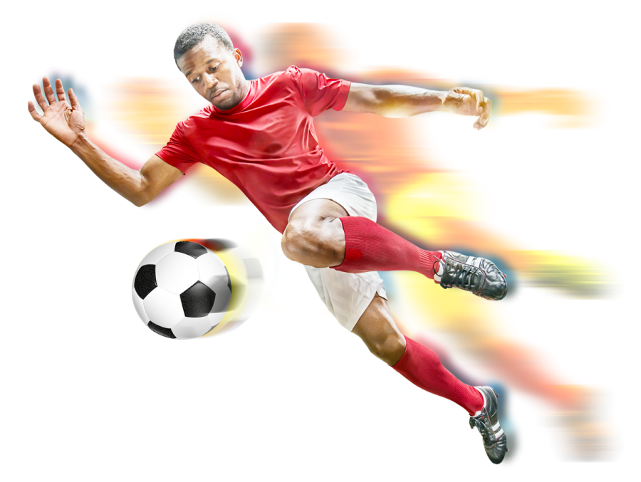 a man in a red shirt kicking a soccer ball