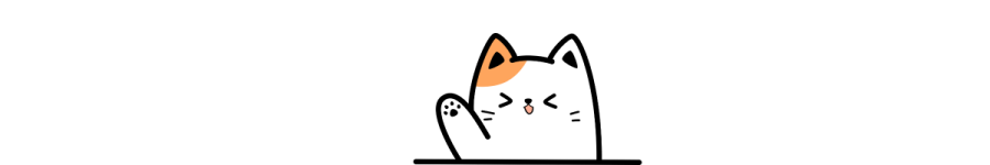 a white and orange cat sitting on top of a table