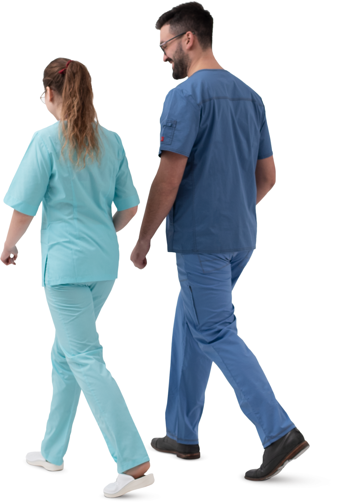 a man and woman in scrubs walking