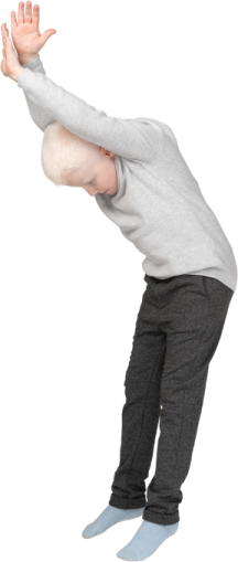 a young boy is doing a trick on his skateboard