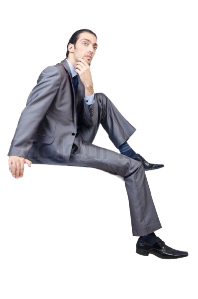 a man in a suit and tie sitting on the floor