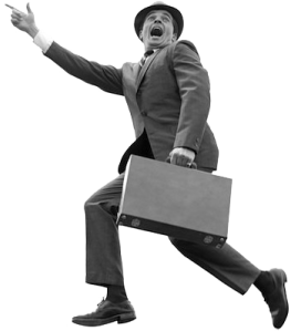 a man in a suit and hat running with a briefcase