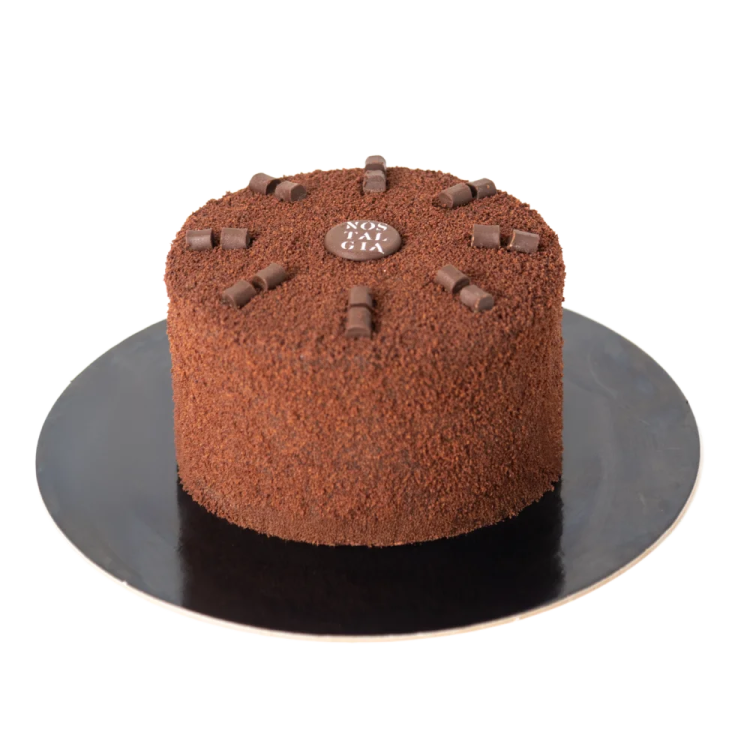 a chocolate cake on a black plate