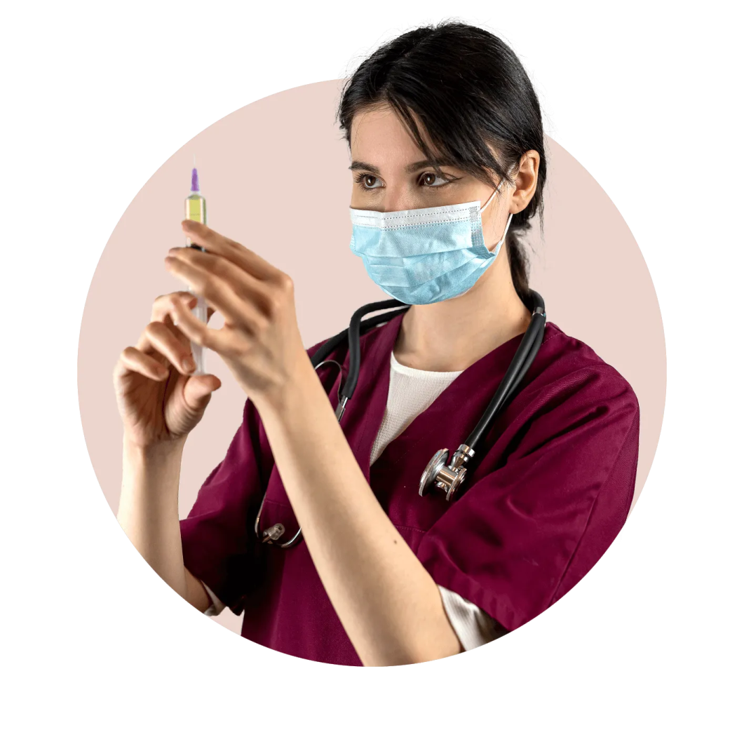 a woman wearing a face mask and holding a sy