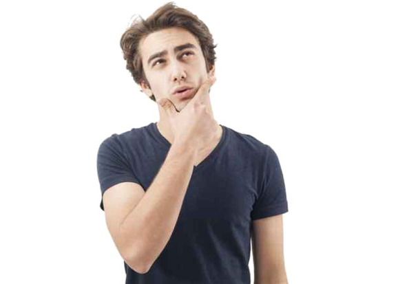a man in a black t - shirt with his hand on his mouth