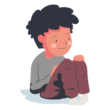 a little boy sitting on the floor with his arms crossed