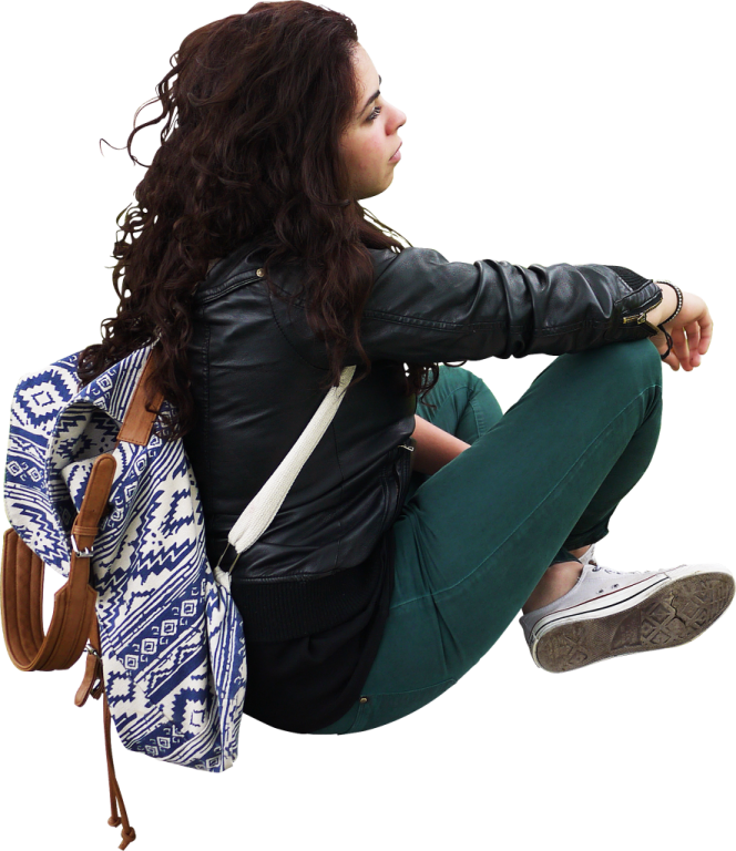 a woman sitting on the ground with a backpack