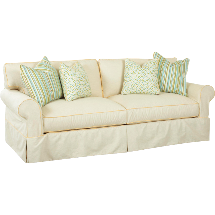 a white couch with blue and green pillows