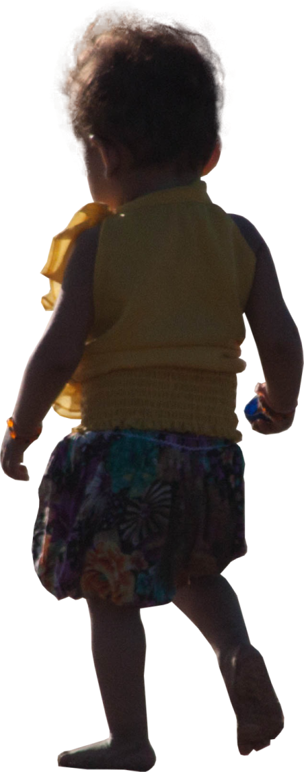 a little girl in a yellow shirt and floral skirt