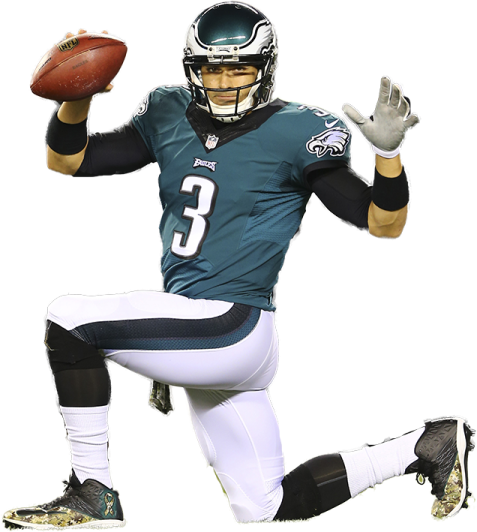 a man in a uniform holding a football ball